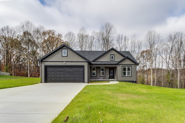 view of front of home featuring a garage and a front yard