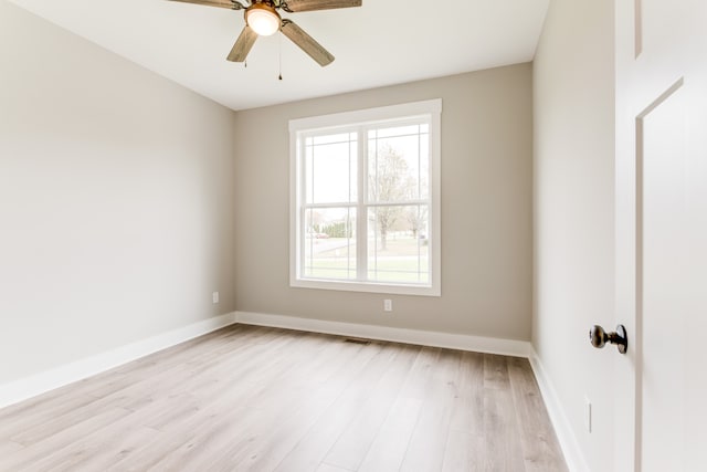 spare room with ceiling fan and light hardwood / wood-style flooring