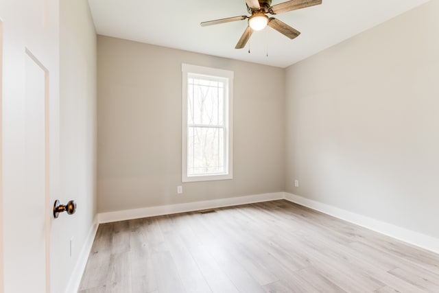 spare room with ceiling fan and light hardwood / wood-style flooring