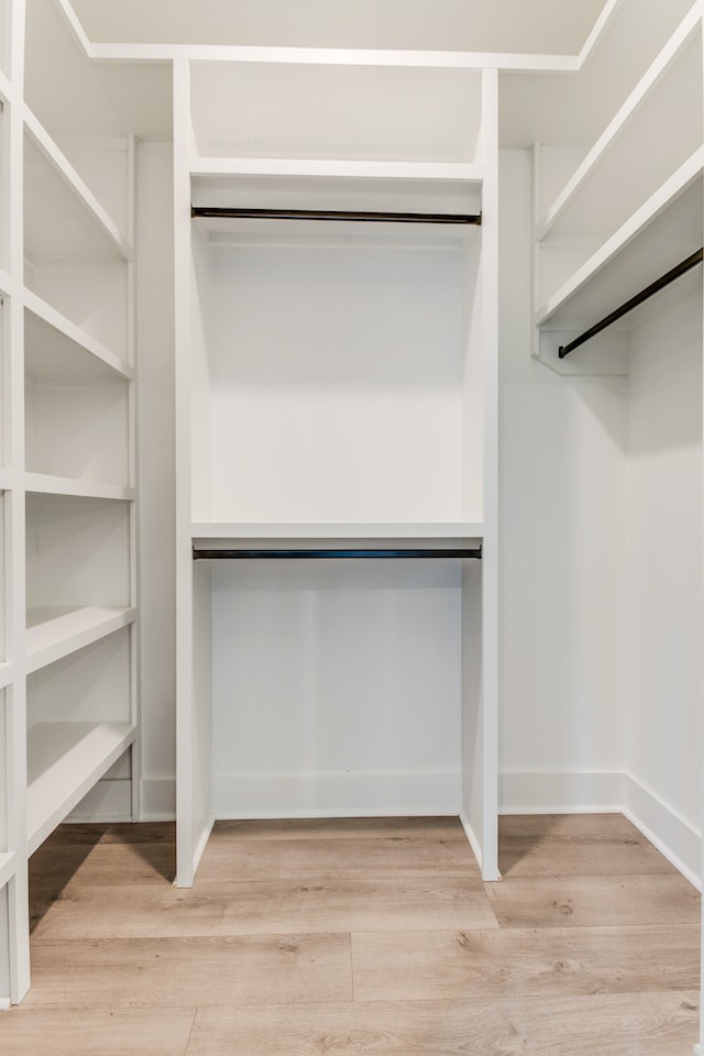 walk in closet featuring light hardwood / wood-style floors