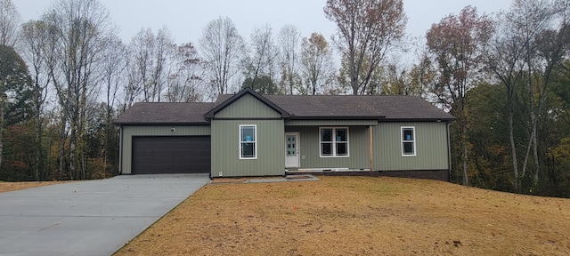 single story home with a front lawn and a garage