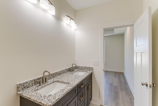 bathroom with vanity and hardwood / wood-style floors