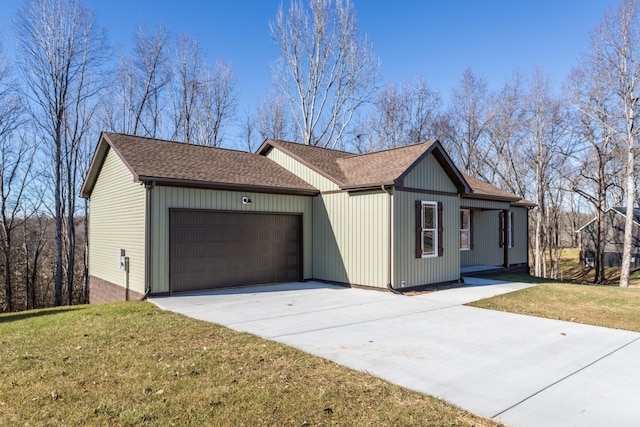 ranch-style house featuring a front yard and a garage