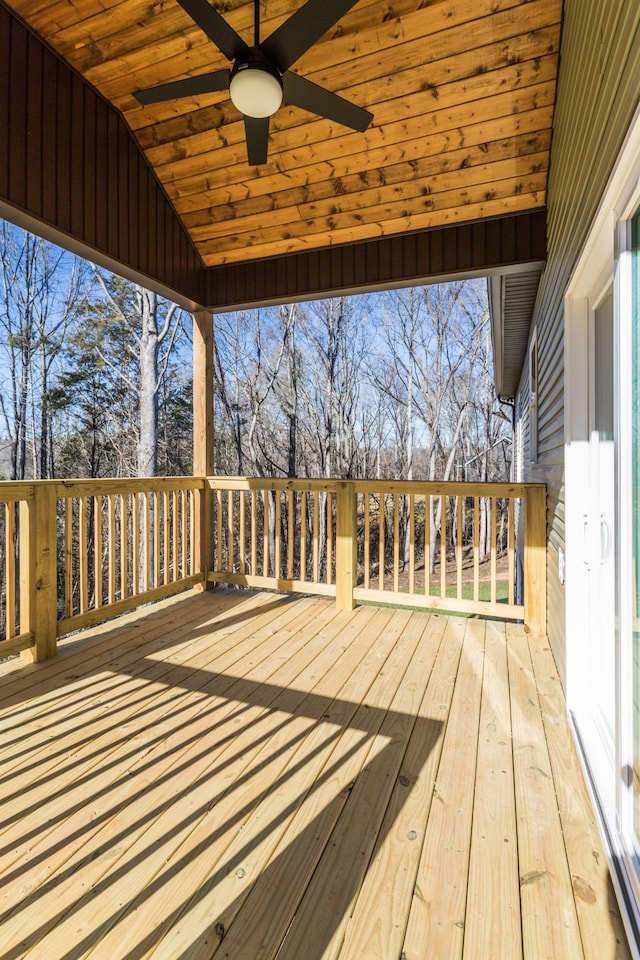 wooden deck featuring ceiling fan