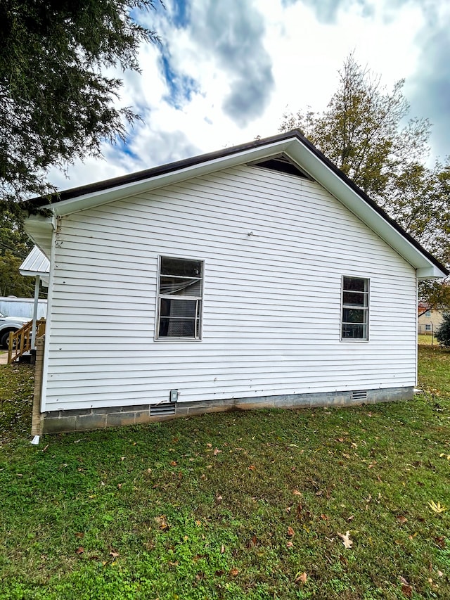 view of property exterior with a lawn