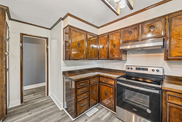 kitchen featuring stainless steel electric range, a textured ceiling, and light wood-type flooring