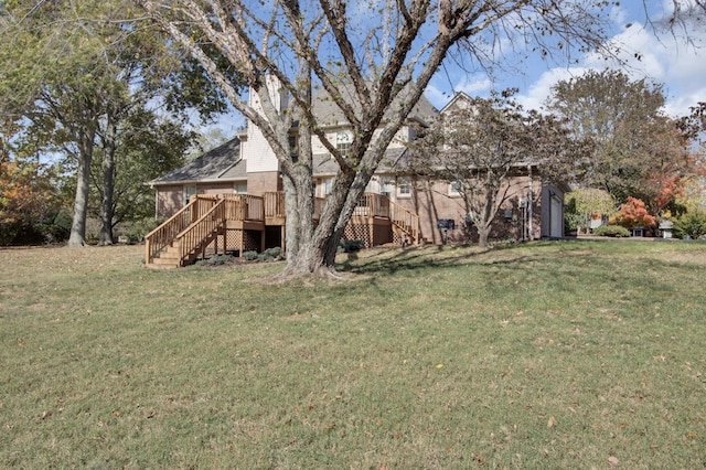 view of yard featuring a wooden deck