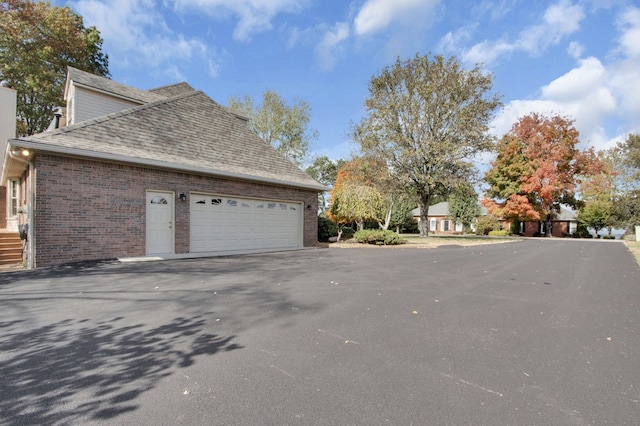 view of side of property with a garage