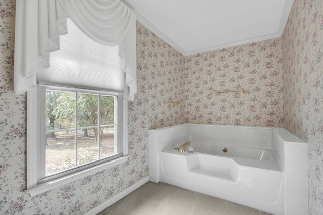 bathroom featuring a tub and ornamental molding