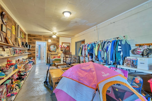 interior space with ceiling fan