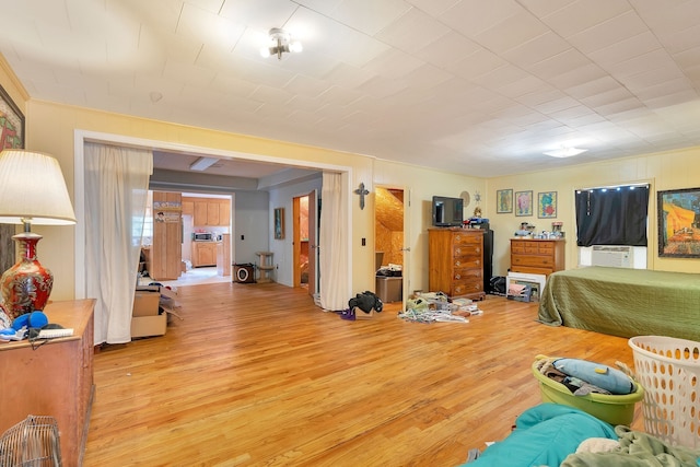 bedroom featuring light hardwood / wood-style floors and cooling unit