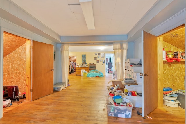 corridor with light hardwood / wood-style flooring