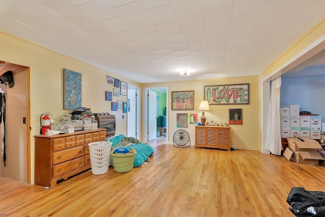 interior space featuring light wood-type flooring and crown molding