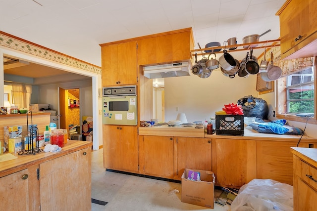 kitchen with gas cooktop, exhaust hood, and oven