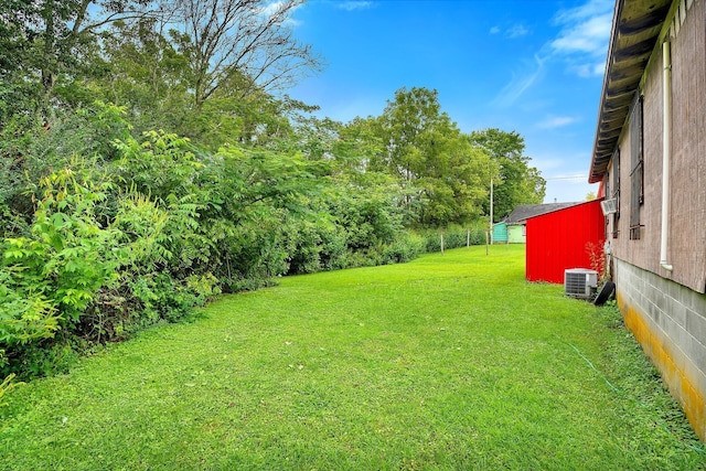 view of yard with central AC unit