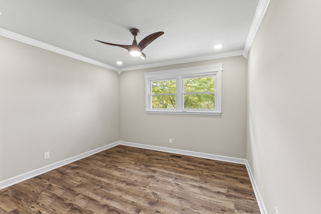 spare room featuring ceiling fan, dark hardwood / wood-style floors, and crown molding