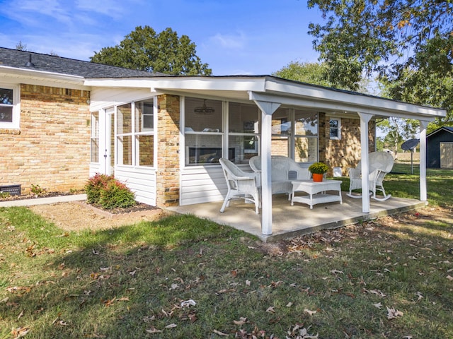 back of house with a yard and a patio area