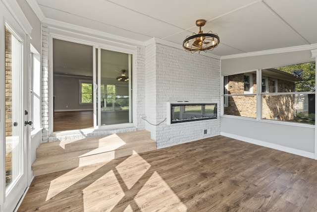 unfurnished sunroom with a fireplace