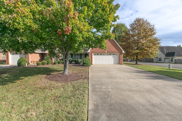 view of front of home with a garage and a front lawn