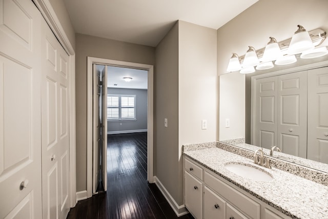 bathroom with vanity and wood-type flooring