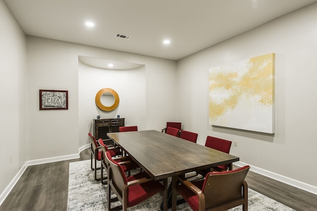 dining area with dark hardwood / wood-style floors