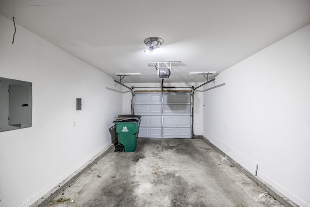 garage featuring a garage door opener and electric panel