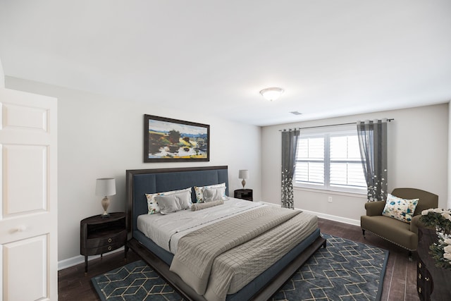 bedroom featuring dark hardwood / wood-style flooring