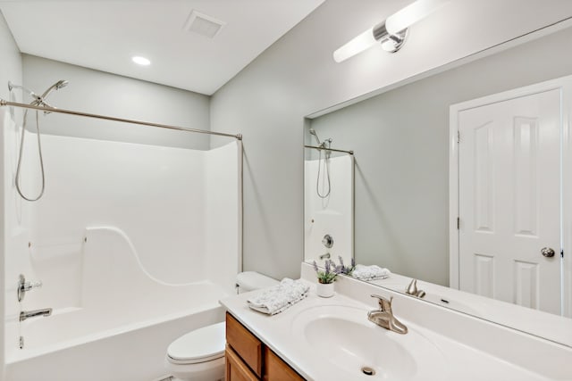 full bathroom featuring shower / tub combination, vanity, and toilet