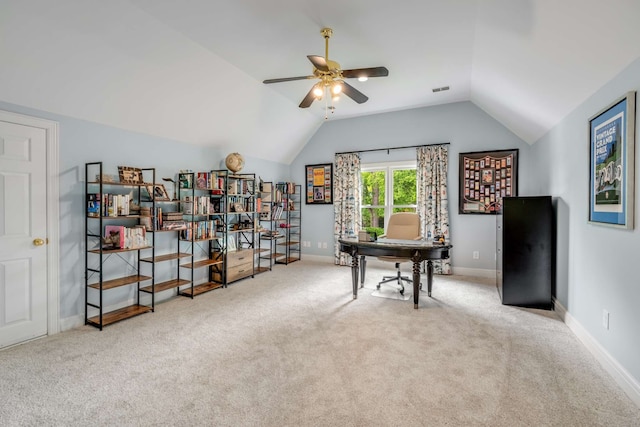 home office with light carpet, ceiling fan, and vaulted ceiling