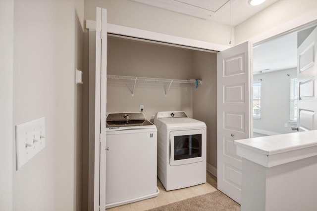 7026 Magnolia Crossings, Spring Hill, TN 37174 - laundry room featuring washing machine and clothes dryer, laundry area, light tile patterned floors, and attic access