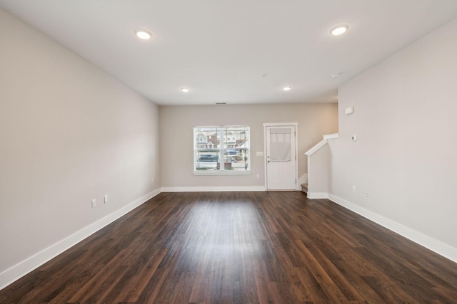 7026 Magnolia Crossings, Spring Hill, TN 37174 - unfurnished living room featuring baseboards, stairway, recessed lighting, and dark wood-type flooring