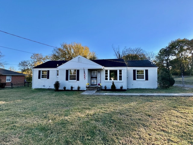 ranch-style home with a front yard