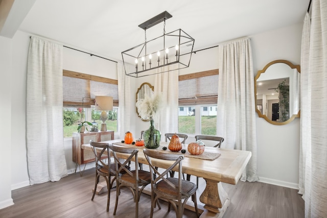 dining room featuring a chandelier and dark hardwood / wood-style flooring