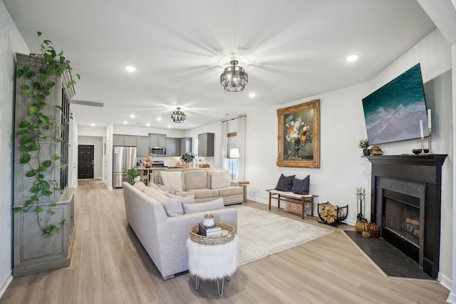 living room with light hardwood / wood-style flooring