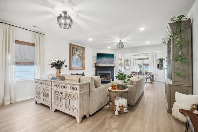 living room with a wealth of natural light and light wood-type flooring