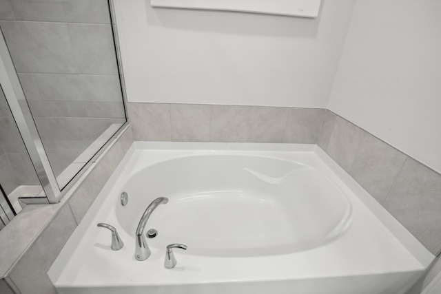 bathroom featuring a tub to relax in