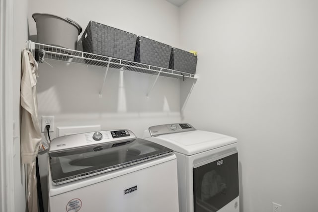 clothes washing area with independent washer and dryer