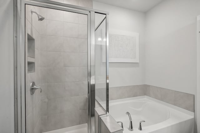 bathroom with independent shower and bath