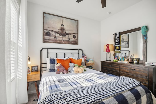 carpeted bedroom with ceiling fan