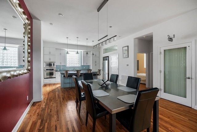 dining room featuring wood-type flooring