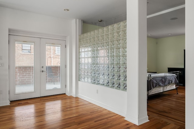 doorway to outside with hardwood / wood-style flooring and french doors