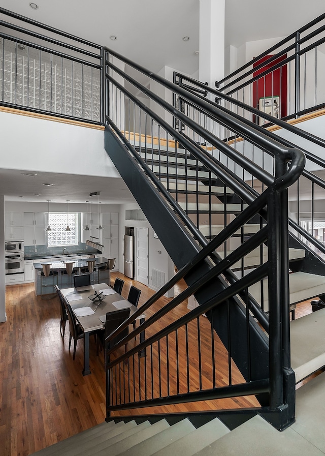 stairway featuring hardwood / wood-style flooring