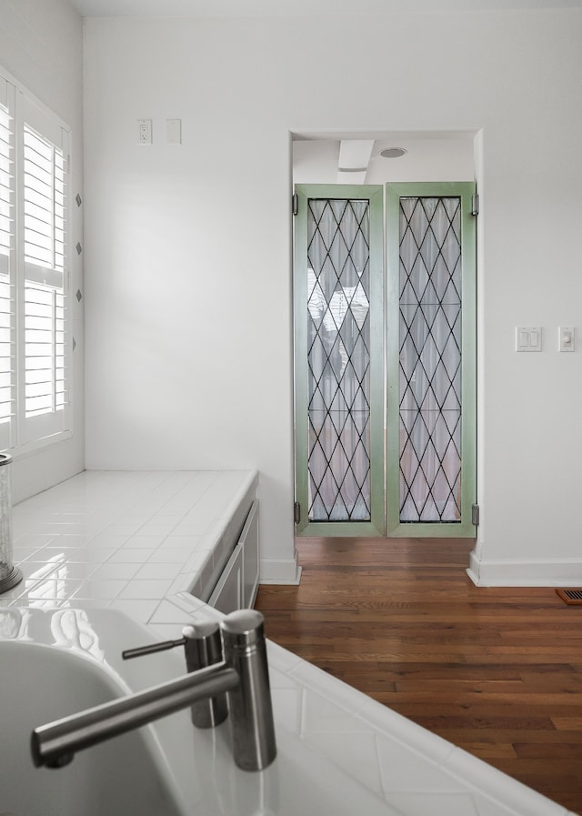 foyer entrance with hardwood / wood-style floors