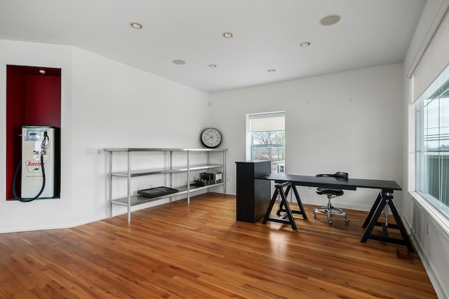 home office featuring hardwood / wood-style flooring and a healthy amount of sunlight