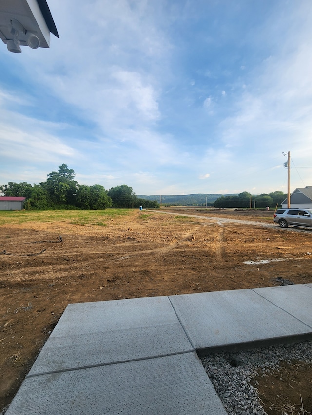 view of yard with a rural view