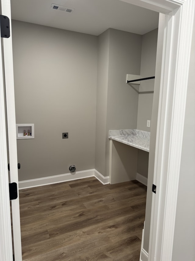 laundry area featuring dark hardwood / wood-style flooring, hookup for a washing machine, and hookup for an electric dryer