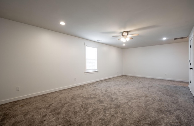 carpeted empty room featuring ceiling fan