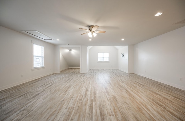 unfurnished room with ceiling fan, a healthy amount of sunlight, and light wood-type flooring