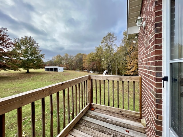 wooden deck with a yard