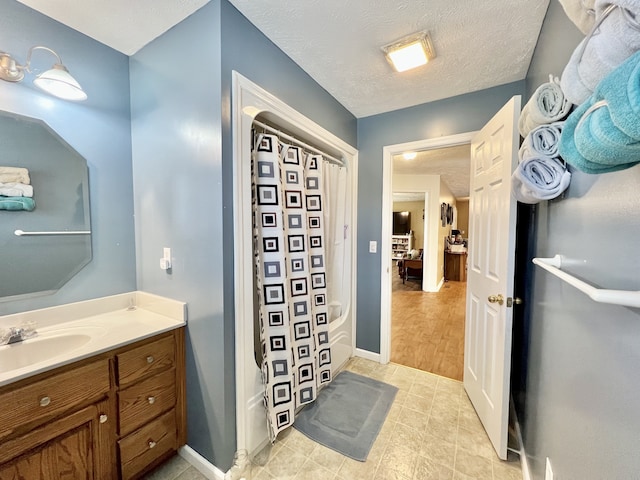 bathroom featuring vanity and a textured ceiling